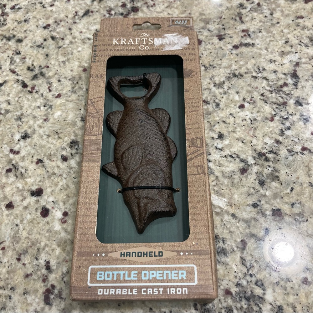 The KraftsMan Co Cast Iron handheld fish bottle opener New in box